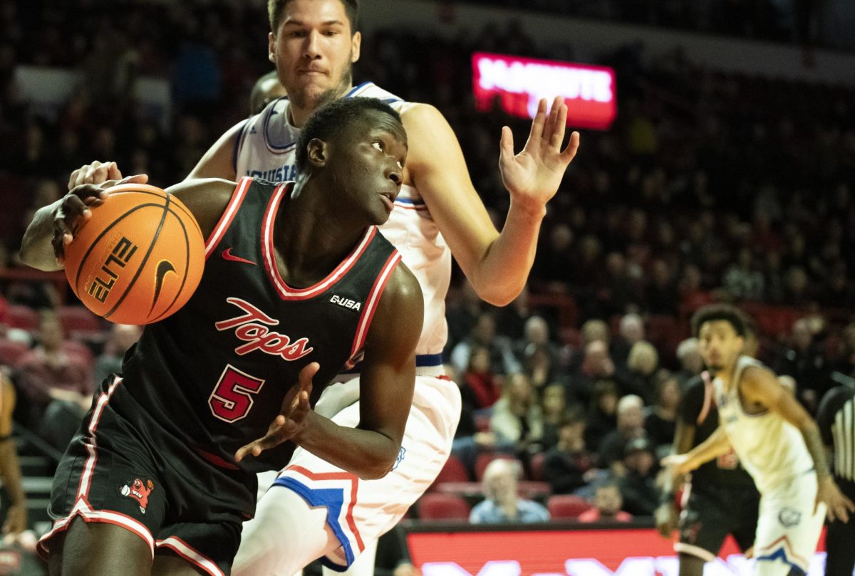 Forward Babacar Faye (5) drives the ball to the basket during Western Kentucky University's game against Louisiana Tech on Wednesday, Feb. 28, 2024.