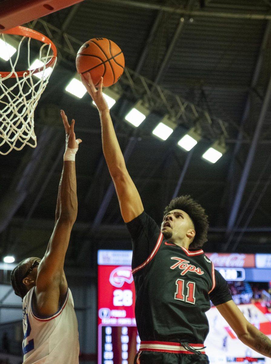 Forward Dontaie Allen (11) goes up for a layup during WKU's game against Louisiana Tech on Wednesday, Feb. 28, 2024.