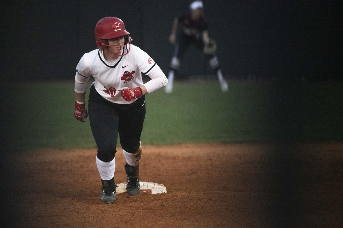Batter Kelsey Schmidt (28) leads off second base during Western Kentucky University's game against Southern Illinois University on Sunday, March 3, 2024. 