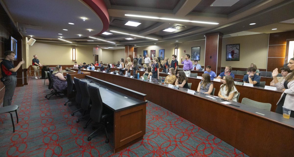 WKU Student Government Association Senate members stand and say their oath as they are sworn into their new committees in the SGA chambers in Bowling Green, Ky. on Aug. 29, 2023.
