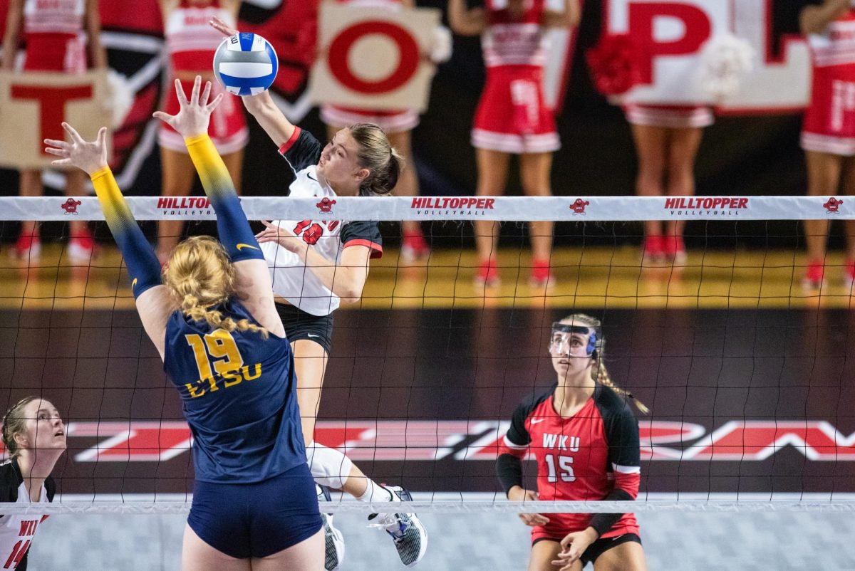 WKU middle hitter Gabby Weihe (10) spikes the ball during the WKU Volleyball match against East Tennessee State University at E.A. Diddle Arena in Bowling Green on Friday, Sept. 16, 2023.