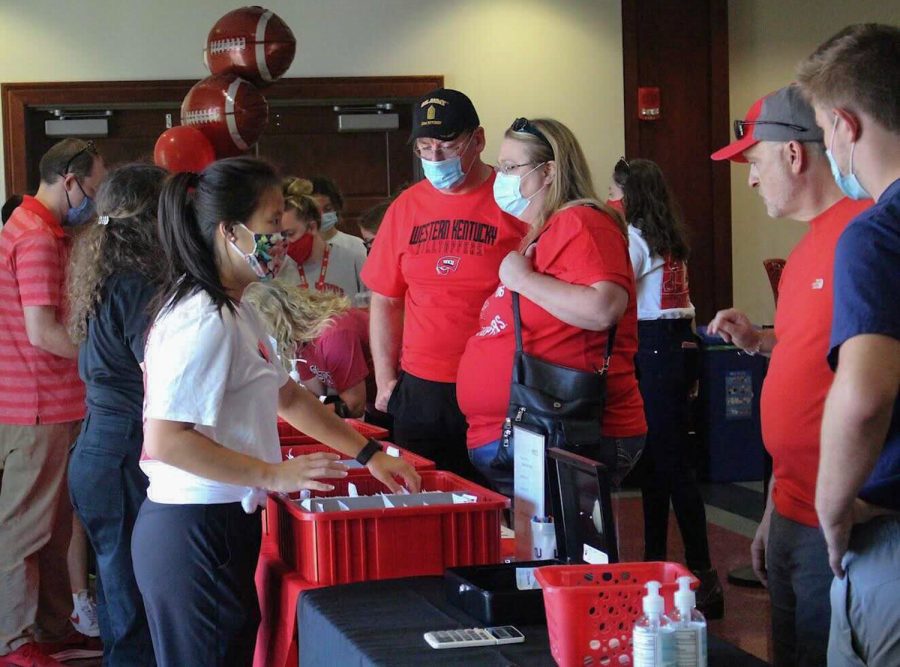 Western Kentucky University's families and students wait in line to pick up their registration packets and t-shirts for WKU's Parent & Family Weekend in Downing Student Union.