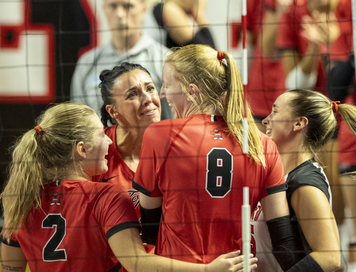 Western Kentucky University rightside hitter Kenadee Coyle (33) celebrates with her teammates after a big play during a match against Middle Tennessee State University at Diddle Arena on Sunday, Oct. 8, 2024.  