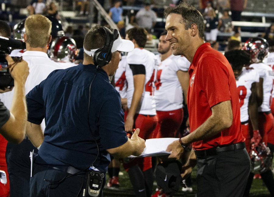 WKU head football coach Tyson Helton chats with FIU head football coach Butch Davis after the Hilltoppers’ 20-14 win at Riccardo Silva Stadium in Miami, Fla. on September 7, 2019.