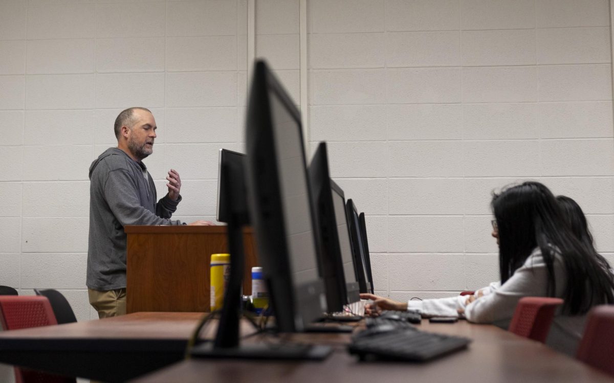 Professor Adam Brownlee teaches his “Moneyball” class in Grise Hall on March 25.