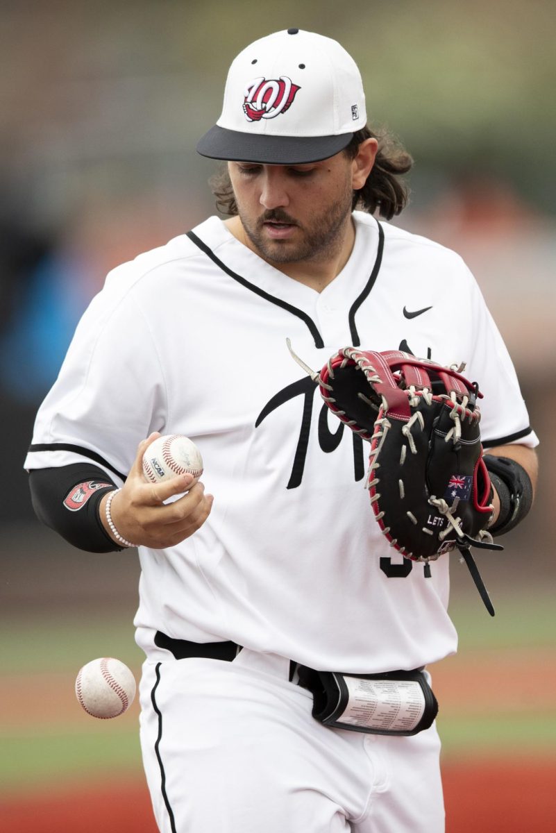 WKU infielder Blake Cavill (34) drops a warmup ball in between innings during the WKU game against the University of Louisville on Tuesday, April 9, 2024.