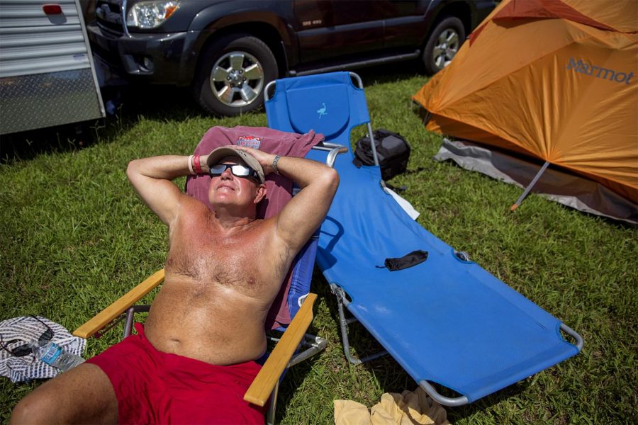 Travis Smith, and girlfriend, Christina Dessart of Frenchtown, Indiana view the Solar Eclipse once it reaches totality in Hopkinsville, Kentucky. "This is a once in a lifetime event and we're happy to be a part of it," Smith said.