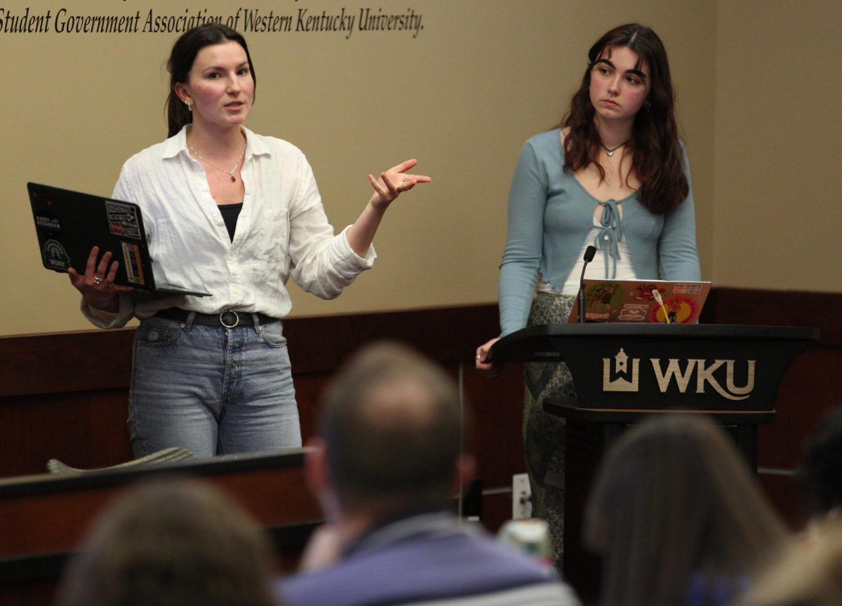 WKU senior public relations student Alex Cissell (left) and SGA Senator at Large Sophia Bryant (right) describe the details of Bill 36-23-S: Funding for the Hope Harbor X Denim Day Event during SGA's 20th meeting of the 23rd senate on Tuesday, March 12 in the senate chambers.