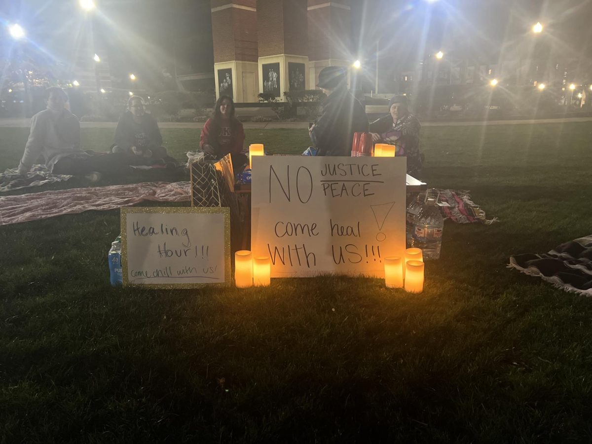 A protest group's sign encouraging people to "come heal with us" following the event.