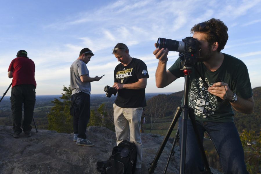 Participants of the Mountain Workshops time-lapse section set up camera equipment to document the sunset at West Pinnacle on Oct. 23 in Berea. The Mountain Workshops hosted a time-lapse workshop led by Grant Kaye for the second year last week. Harrison Hill/HERALD