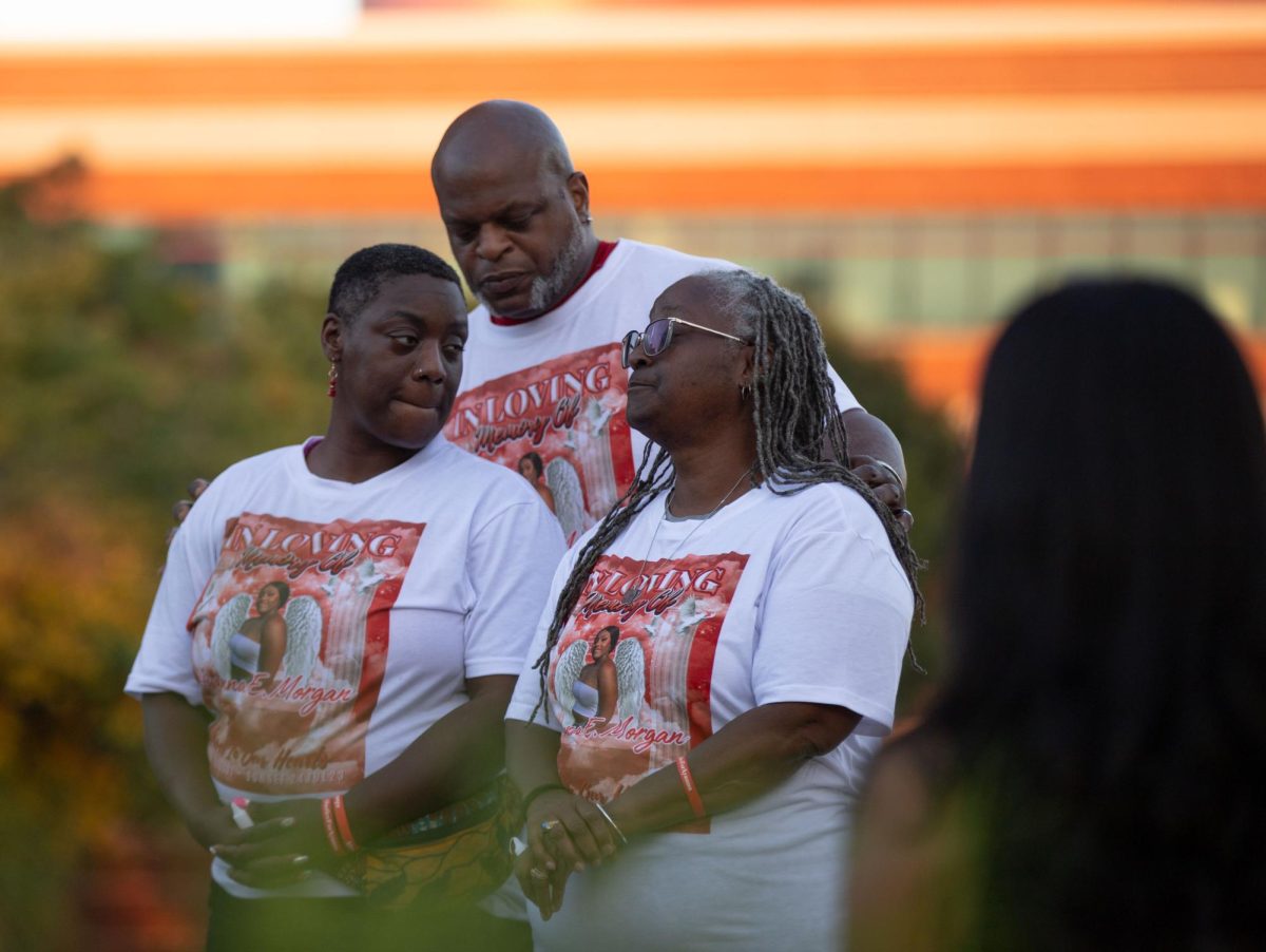 (From to left to right) Ayanna Morgan’s family members Misha Baskerville, Lord Zilverbakk-Omega Prime and Veronica Hiriams embrace during a vigil for Morgan at Guthrie Bell Tower in Bowling Green, Ky. on Tuesday, August 29, 2023. “Just got to keep her (Baskerville) standing," Prime said. "That's my job."