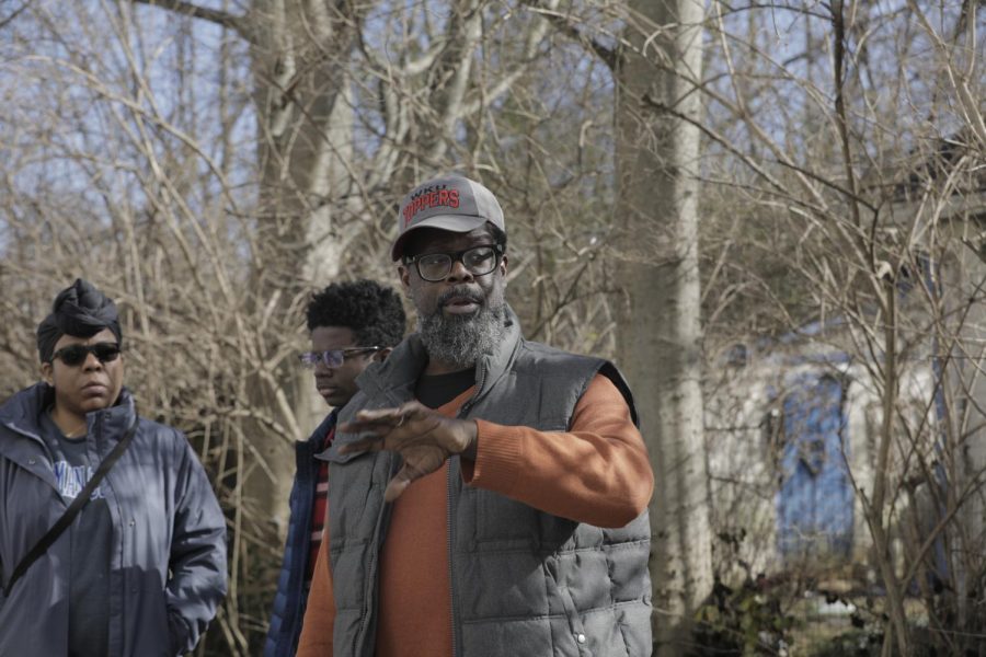 Lamont Jack Pearley, husband to Denise (left) and father of Lamont Jr. (center), sets the scene of what happened to his family's neighborhood on Dec. 11.
