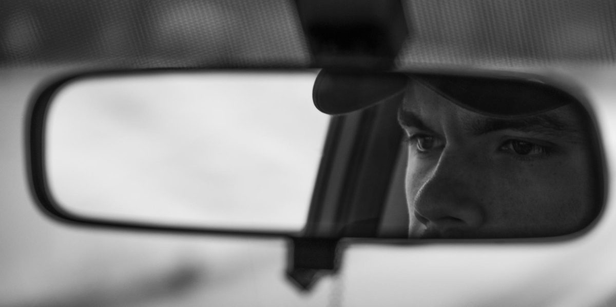 Graham Martin fixes his eyes on the road in front of him as he drives toward Louisville from Bowling Green on I-65 on April 2, 2024.