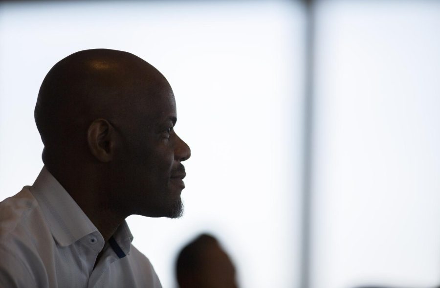 Frank Aryee sits in his spot and awaits the end of the naturalization ceremony at the Muhammad Ali Center in downtown Louisville that will end his 11-year journey to U.S. citizenship on Friday, Sept. 2, 2022. 