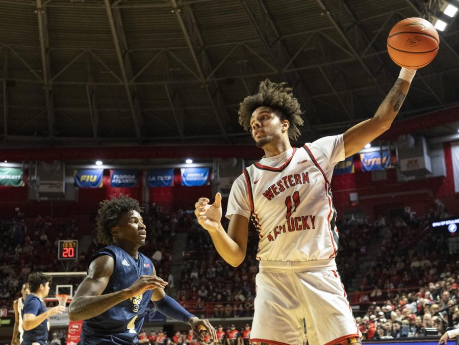Redshirt junior shooting guard Dontaie Allen (11) catches an inbound during the matchup with FIU in E.A. Diddle Arena on Saturday, Jan. 14, 2023. WKU won 70-59.
