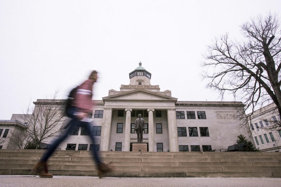 A student walks in front of Cherry Hall on Feb. 22, 2020.
