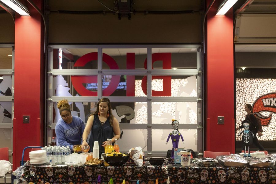 Valery Garcia (left) and Veronica Portillo prepare for the celebration of Dia de los Muertos at Downing Student Union on Thursday, Nov. 3, 2022. 
