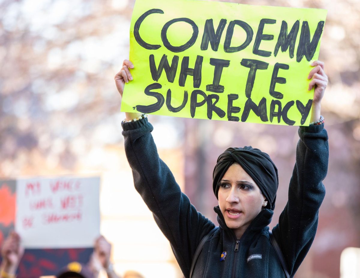 Senior and Sigma Gamma Rho member Noami Desrosiers protests Kyle Rittenhouse speaking at a Turning Point USA event outside of the Downing Student Union on Wednesday, March 27, 2024. “I’m with my sisters, we have to be civically involved… and show that we have a voice,” Desrosiers said.