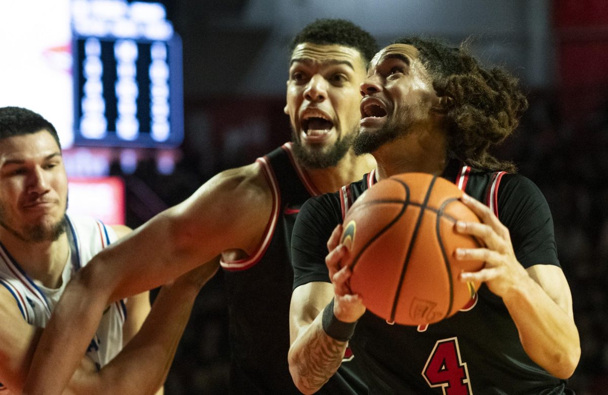 Guard Khirstian Lander (4) drives the ball to the basket during WKU's game against Louisiana Tech on Wednesday, Feb. 28, 2024.