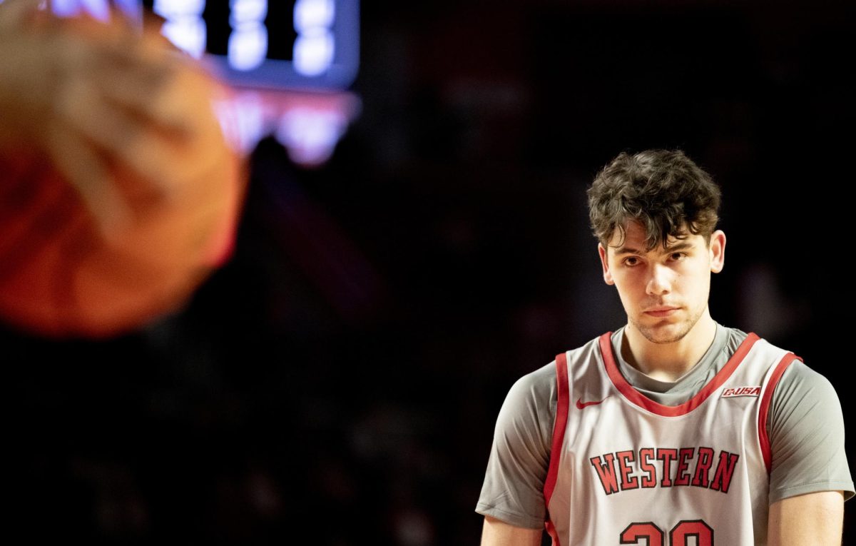Guard Teagan Moore (30) stares down the ball before a free throw during WKU's game against Sam Houston in the Diddle arena on Thursday, Feb. 1.