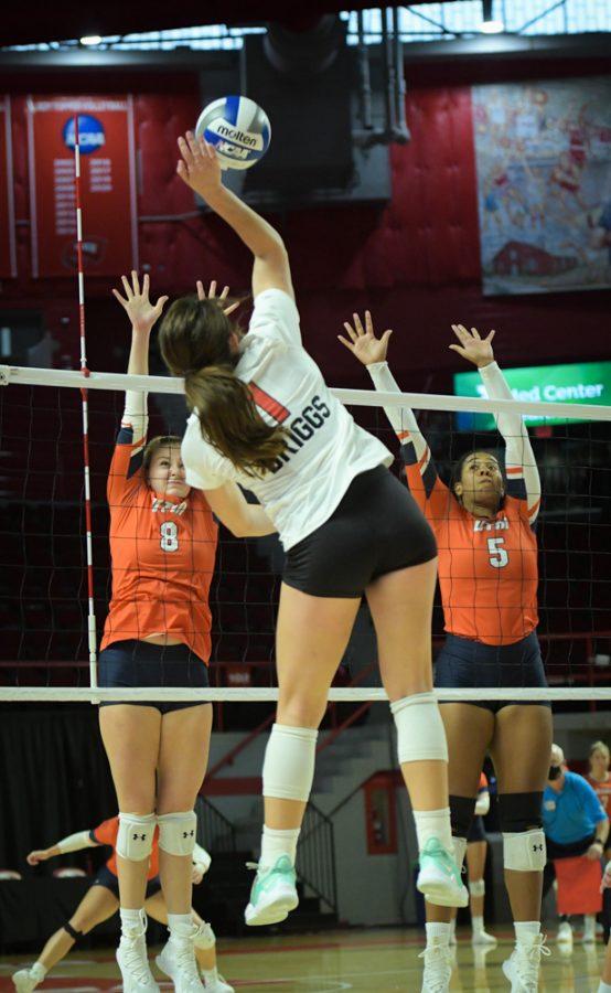 WKU Hilltoppers' outside hitter Paige Briggs (1) jumps for spike against UT Martin in a 2021 contest.