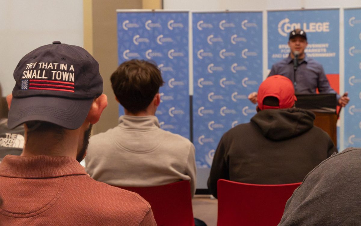 A “Rittenhouse Recap” attendee listens as Kyle Rittenhouse tells his story in the Downing Student Union Nite Class on Wednesday, March 27, 2024.