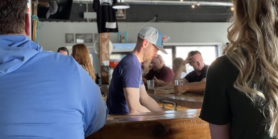 Aaron Hawkins tends to customers on Friday, April 22. Hawkins works as a planner for the city of Elizabethtown when he's not pouring pints.