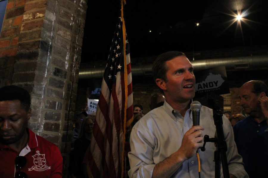 Gov. Andy Beshear gives a speech at Spencer's Coffee downtown during his reelection tour stop in Bowling Green.