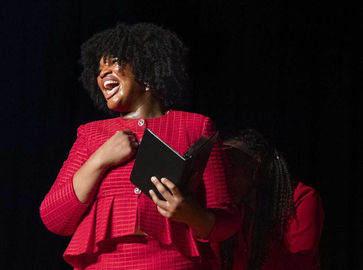Jade Ismail, a member of WKU Forensics, performs a speech during the Black Experience Showcase in the Downing Student Union auditorium on Wednesday Feb. 28, 2024.