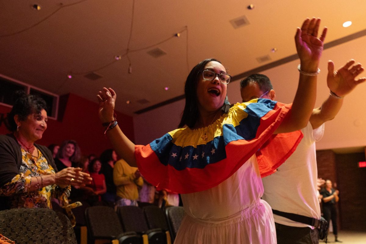 Karla Olmos and Luis Villarreal dance together to the last song of Larry Bellorín and Joe Troop’s concert in the Ivan Wilson Fine Arts Center in Bowling Green, KY on Aug. 31, 2023.