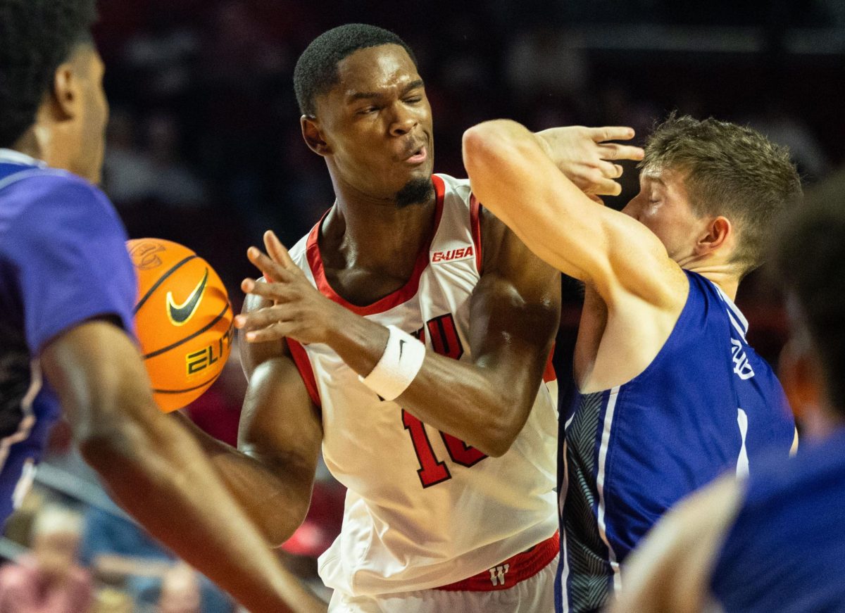 Guard Brandon Newman (10) attempts to pass the ball through Panthers defense during the first game of the season in the Diddle arena on Monday Nov. 6, 2023. 
