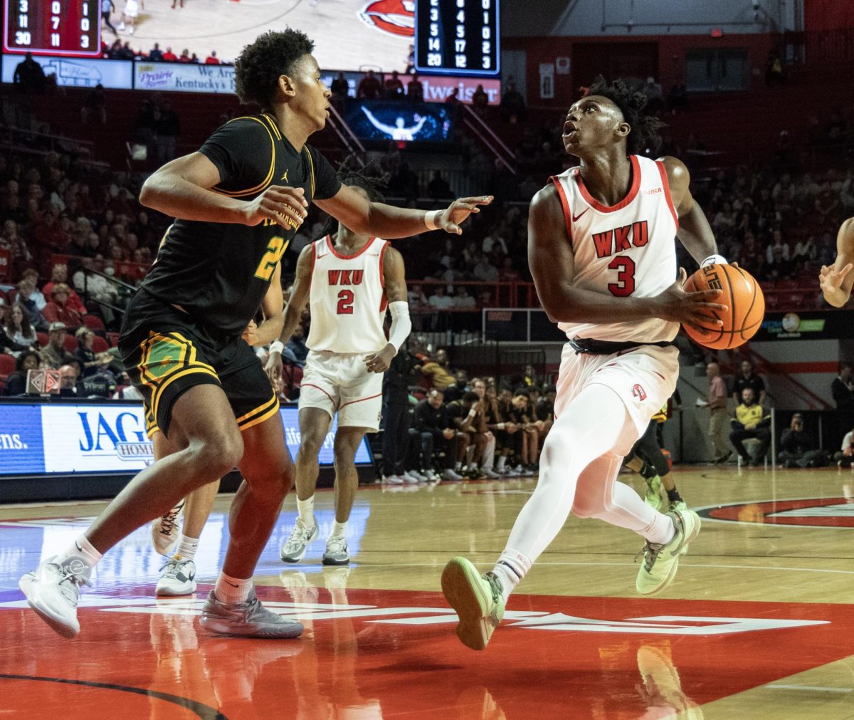 Fifth-year senior guard Jalen Jackson locks eyes on the goal during the November 19 game at E.A. Diddle Arena.