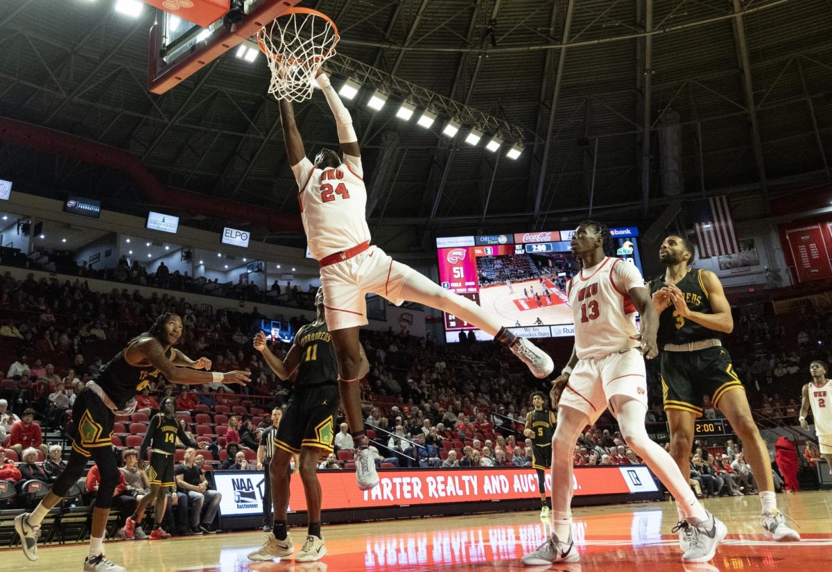 Senior forward Tyrone Marshall Jr. dunks the ball during the game against Kentucky State on November 18, 2023.
