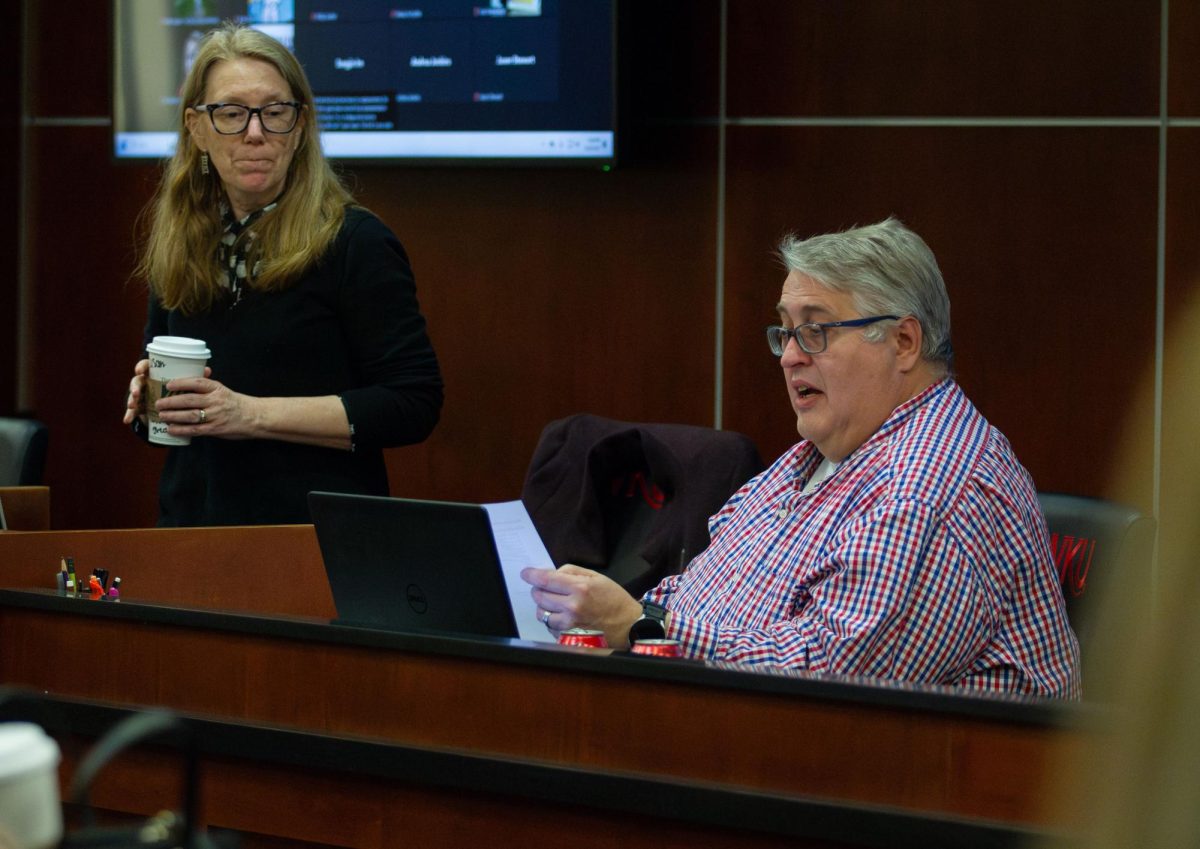 Doug Smith, vice chair of the WKU Faculty Senate, reads his officer report at the Faculty Senate meeting on Thursday, March 28, 2024.