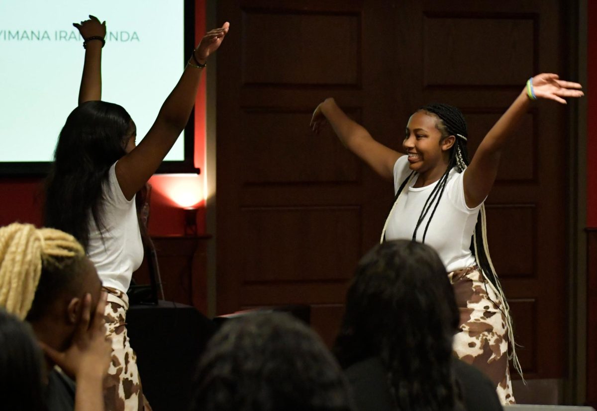 Muhayimana Irankunda (left), a sophomore social work major, and Chantal Umuhoza, A junior accounting major, perform a traditional African dance about marriage at "Noir: A night of Black Excellence" on Wednesday, Jan. 31. 