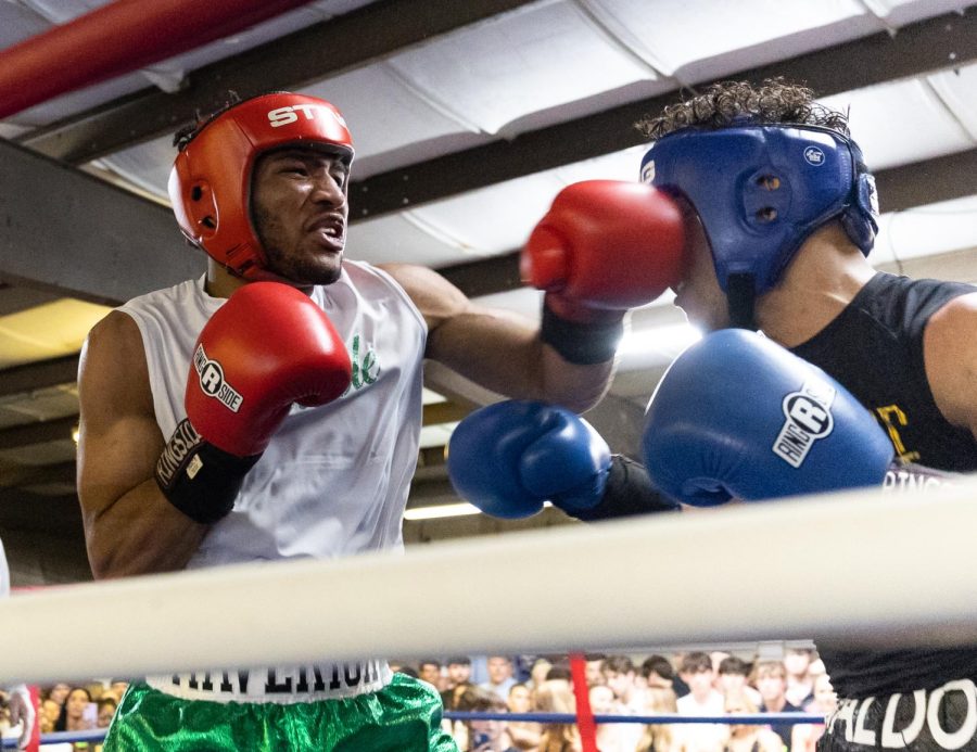 Ebenezer “Stuntman” Griffith (left) narrowly misses a punch against Aaron Walden (right) during their bout on Friday, March 31, 2023 at Lampkin Park in Bowling Green, Ky. at the WKU Sigma Chi Fight Night event to raise money for Huntsman Cancer Institute. Griffith lost the match. 
