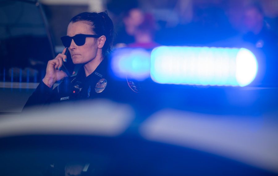 An officer with the Bowling Green Police Department makes a phone call from Smoke Zone on 116 Old Morgantown Road Thursday, Feb. 23, 2022 just off the WKU campus in Bowling Green, Ky. 