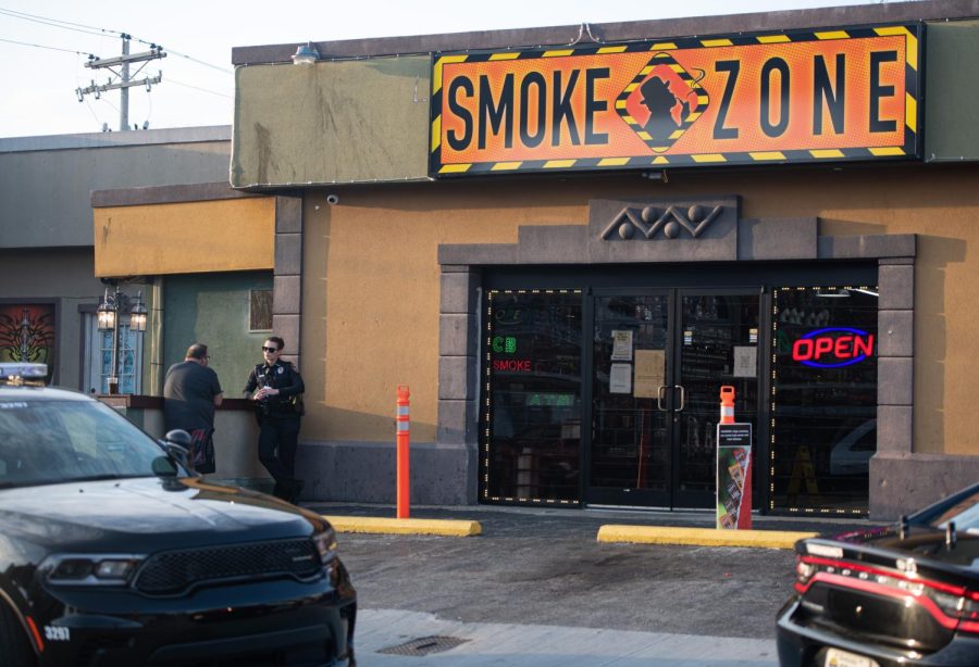 An officer with the Bowling Green Police Department interviews people at Smoke Zone on 116 Old Morgantown Road Thursday, Feb. 23, 2022 just off the WKU campus in Bowling Green, Ky. 