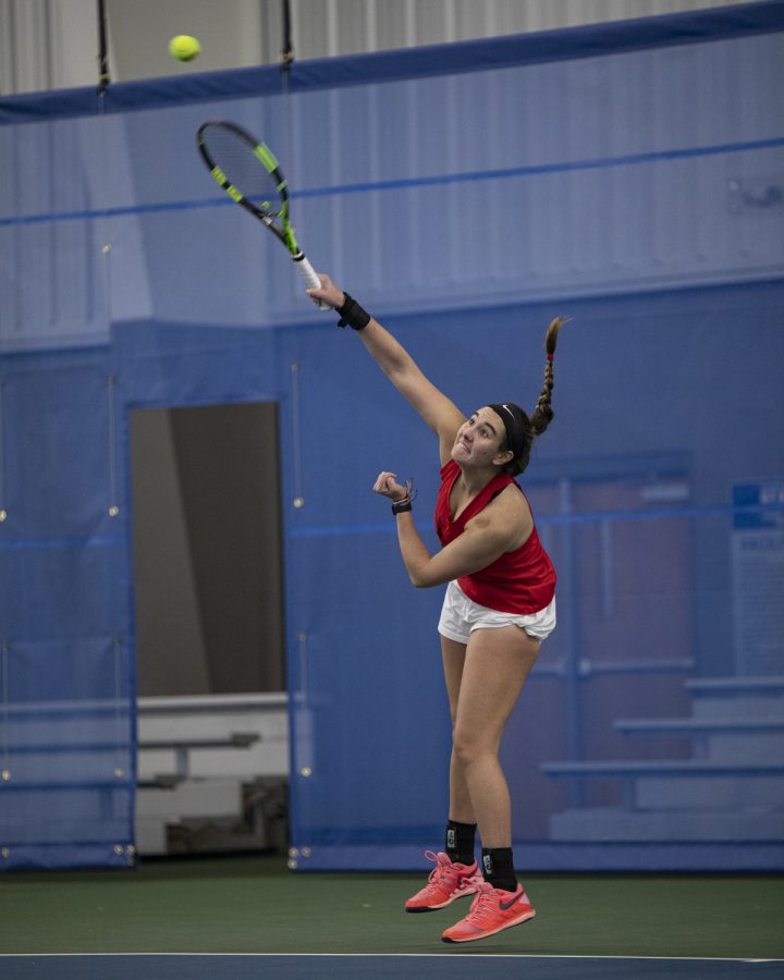 Western Kentucky University Hilltoppers redshirt sophomore Alexis Cramer serves the ball to Indiana University–Purdue University Indianapolis Jaguars junior Marta Krakowski on the afternoon of Sunday, Feb. 6, 2022, at Michael O. Buchanon Park’s tennis facility. WKU won the match 7-0.