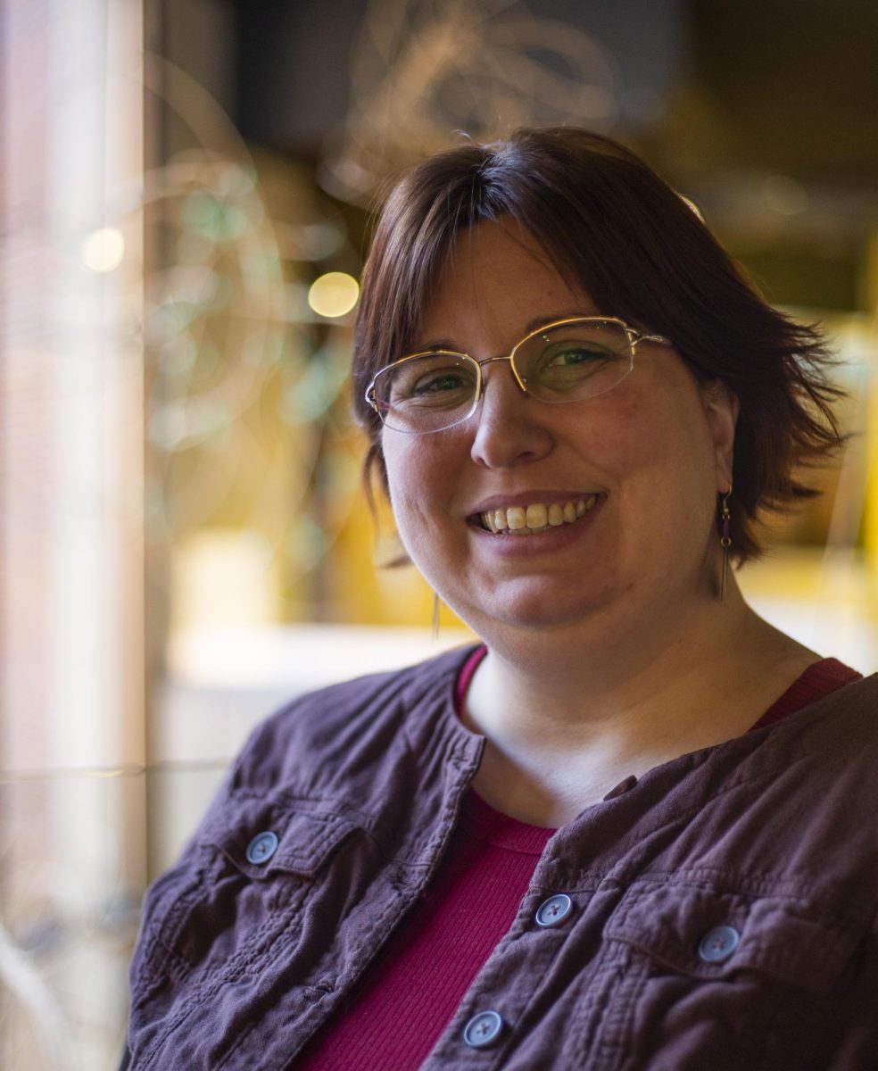 Tiffany Isselhardt, museum curator and author of ‘Exploring American Girlhood’ poses for a portrait in the Kentucky Museum.