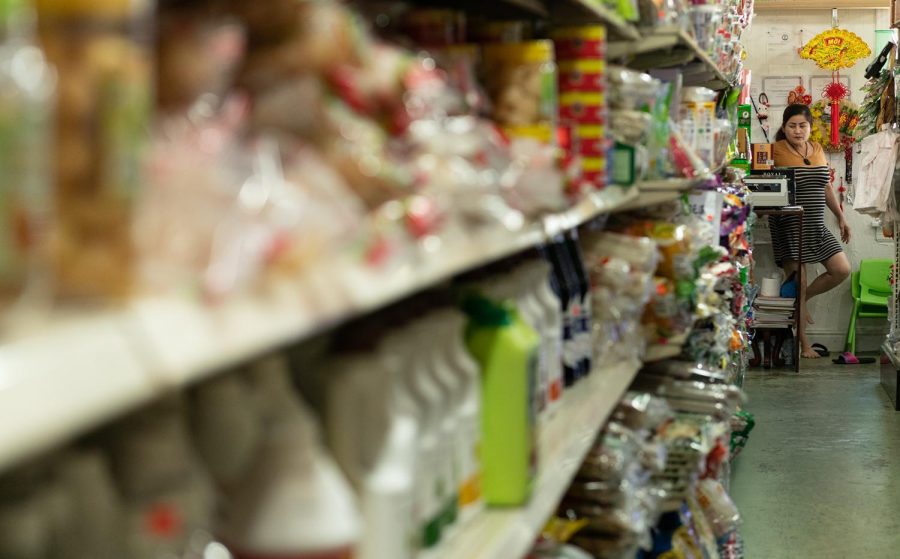 Store co-owner Be Ta, a Vietnamese immigrant, works the register at Cho Vietnam Market in Bowling Green.