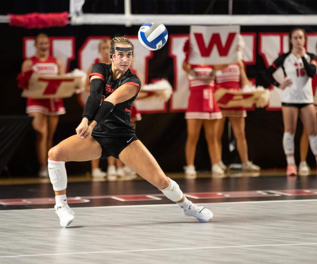 Defensive Specialist Abby Schaefer bumps the ball during the WKU Volleyball match against University of Arkansas at the E.A Diddle Arena in Bowling Green on Wednesday, Sept. 8, 2023. 
