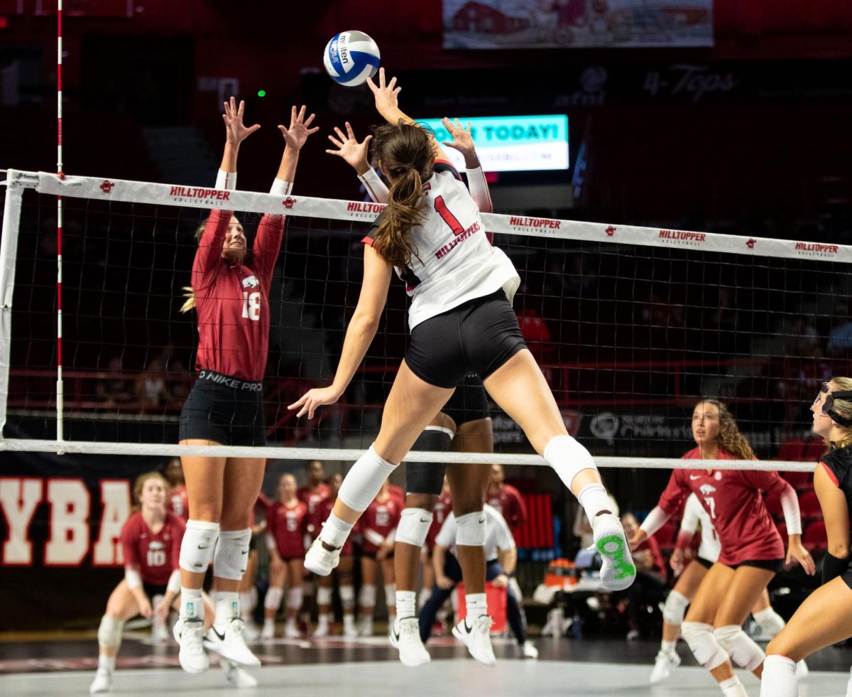 Outside hitter Paige Briggs spikes the ball during the WKU Volleyball match against University of Arkansas at the E.A Diddle Arena in Bowling Green on Wednesday, Sept. 8, 2023. 