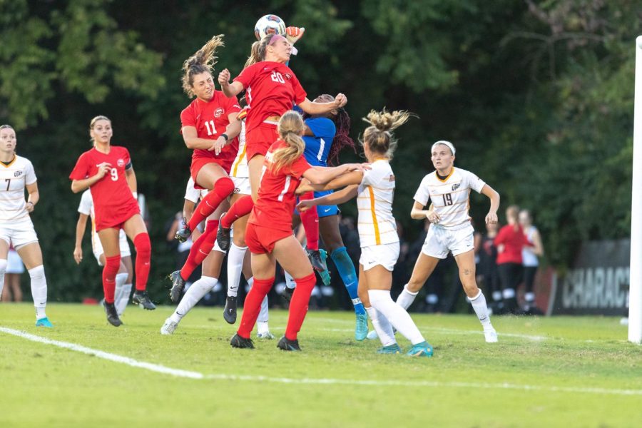 WKU #11 Ellie Belcher and #20 Ansley Cate go head-to-head with University of Texas at El Paso goalkeeper #30 Mariah Scott in an attack on goal on Sept. 22, 2022.  WKU upset the Miners 1-0.