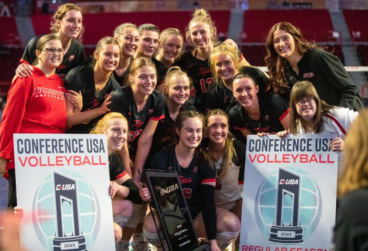 WKU women’s volleyball poses with the C-USA regular season champions trophy after they defeated FIU 3-0 at Diddle Arena on Nov. 4, 2023. 