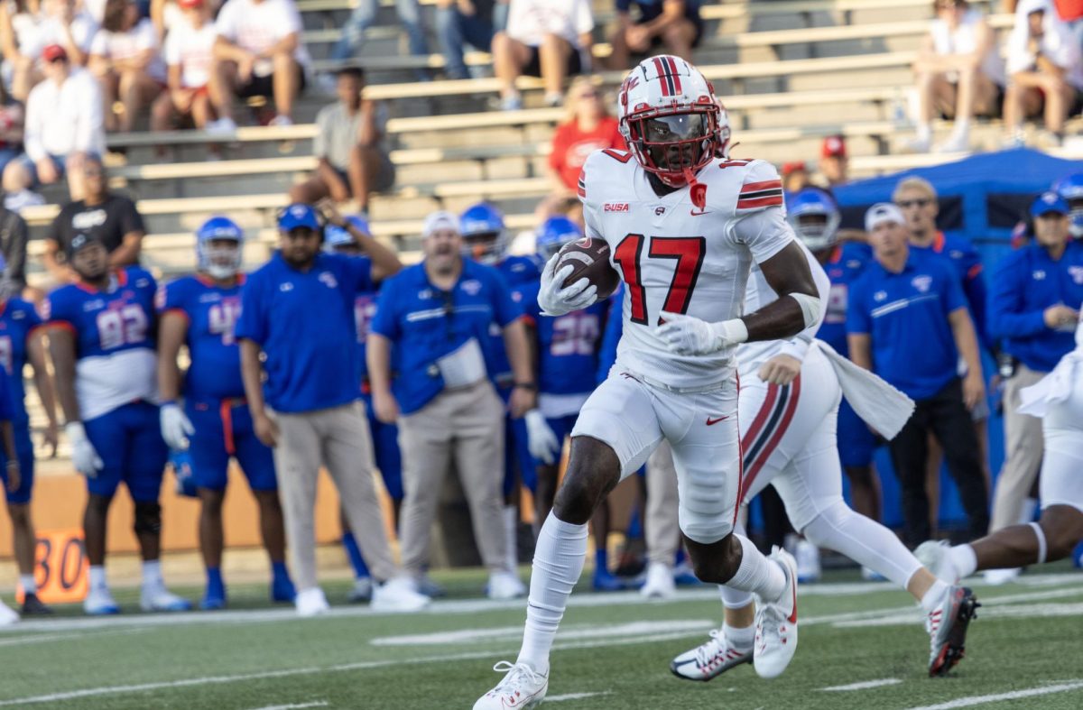 Junior wide receiver Dalvin Smith (17) runs the ball down the field during a game against Houston Christian on Sept. 9, 2023. 