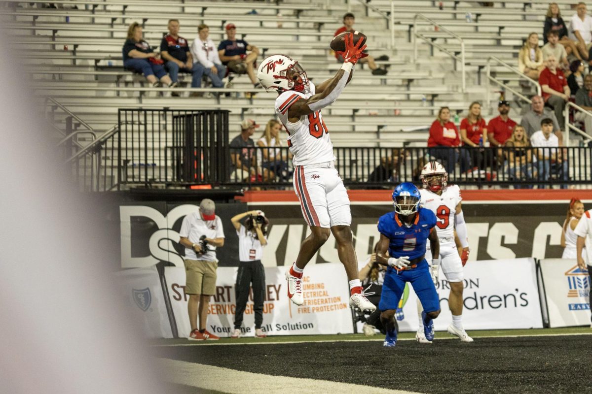 Junior wide receiver Denzil Alleyne (82) catches a pass in the end zone and scores a touchdown during a game against Houston Christian on Sept. 9, 2023. 
