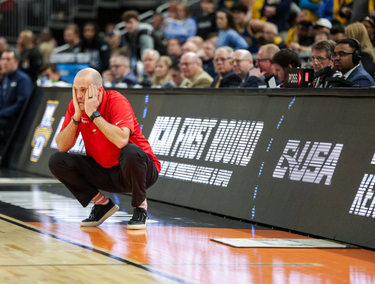WKU Head Coach Steve Lutz puts his head in his hands towards the end of the second half of WKU’s game against Marquette during the March Madness Round of 64 at the Gainbridge Field house in Indianapolis on Friday, March 22, 2024. Marquette won 87-69 and advanced to the second round of the tournament.