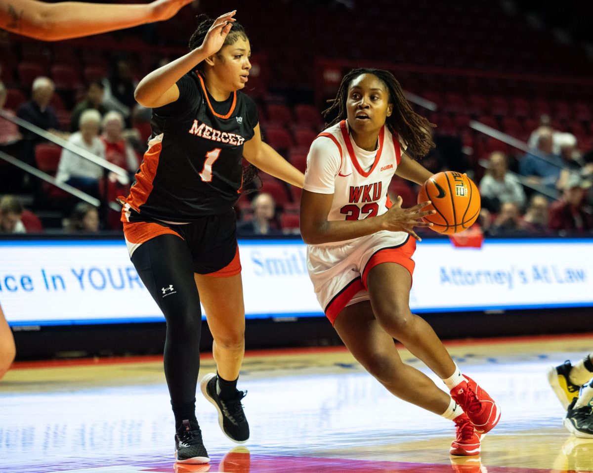 Guard Karris Allen (32) drives the lane during a game against the Mercer Bears in the Diddle arena on Monday, Nov. 6, 2023.